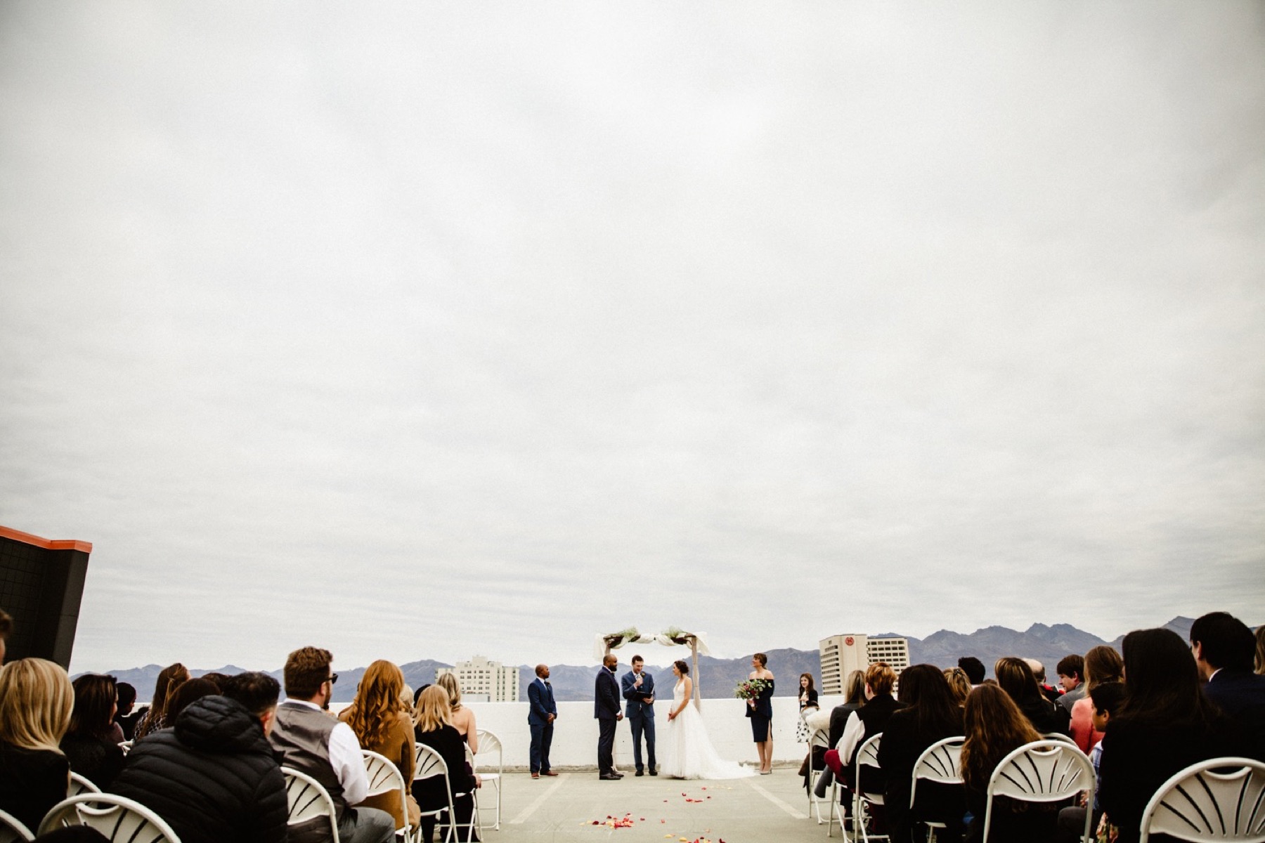 bride and groom wedding ceremony on rooftop of easy park garage in downtown anchorage
