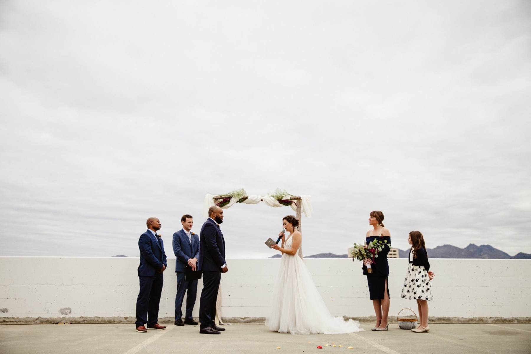 bride and groom wedding ceremony on rooftop of easy park garage in downtown anchorage