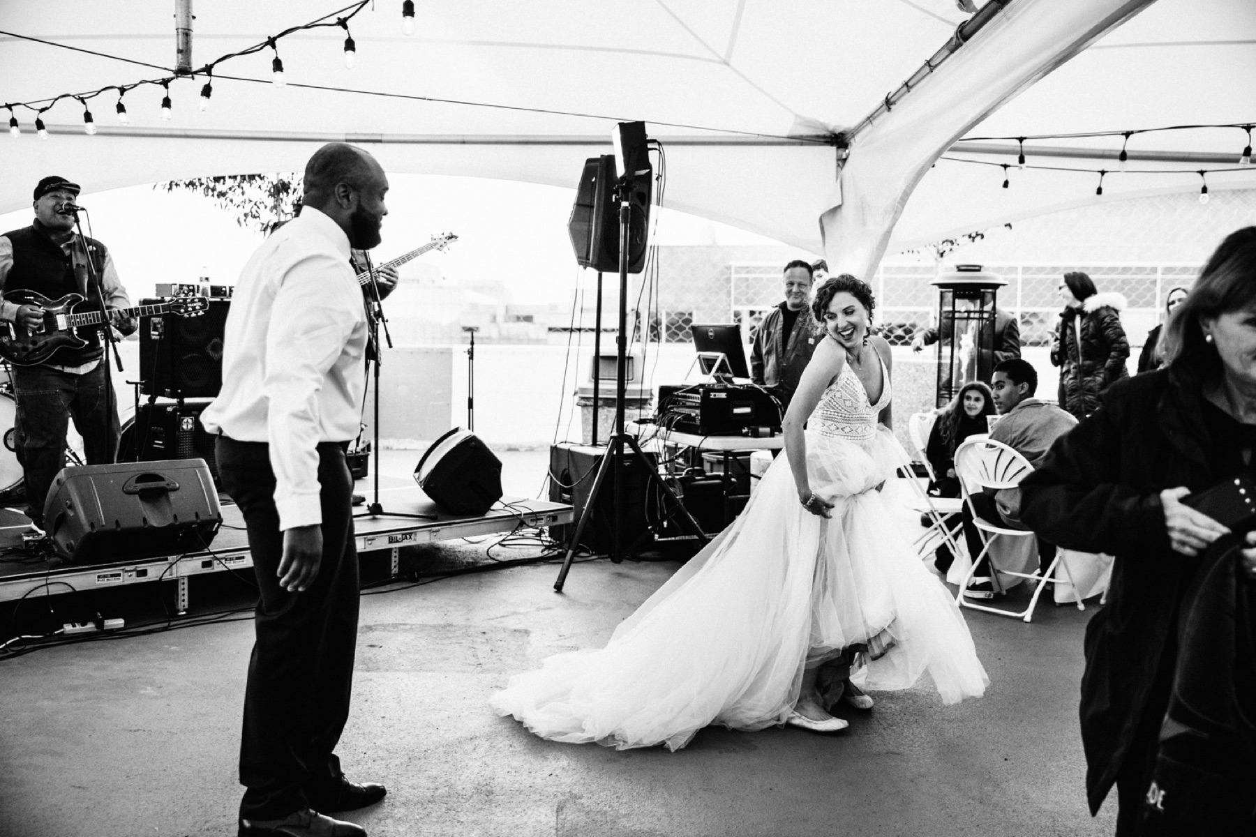 bride and groom enjoy a joyful first dance