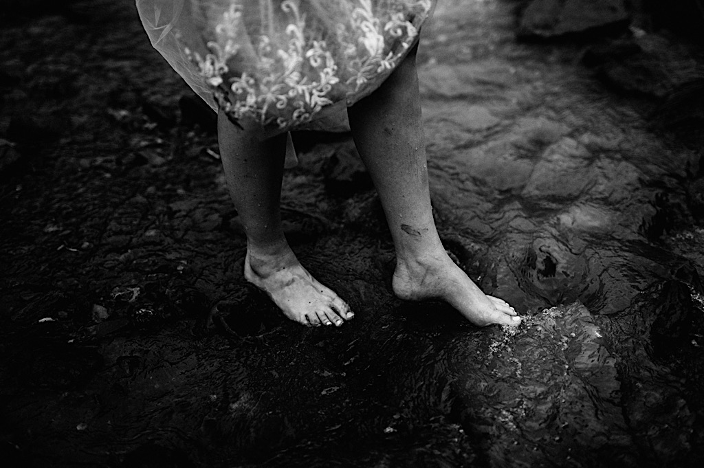 bride wading in crow creek with bare feet
