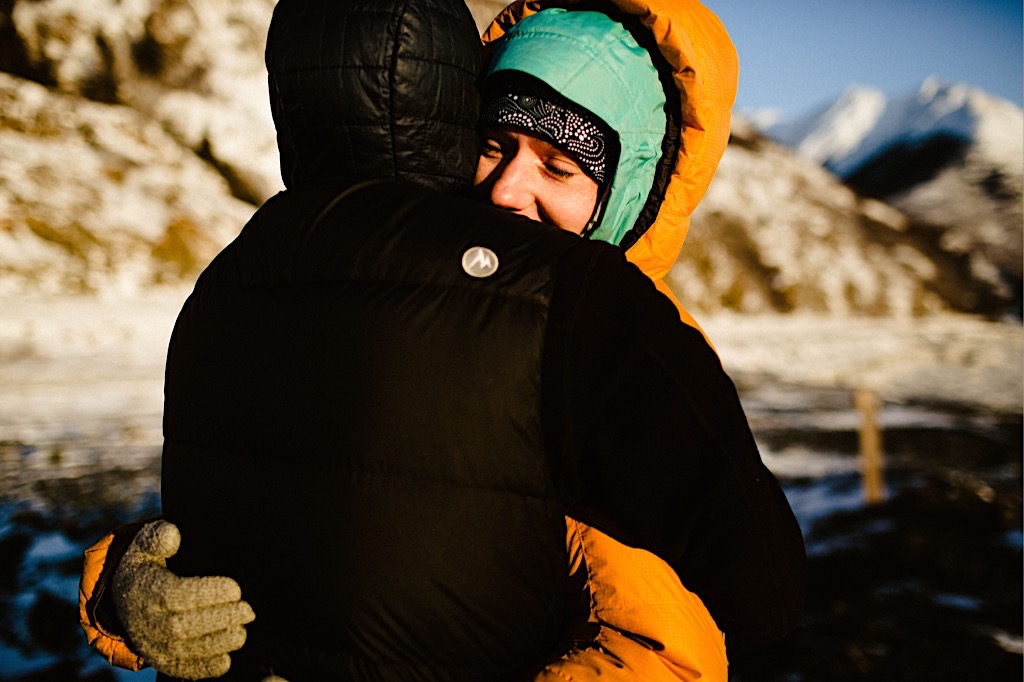 couple hugging in winter coats 