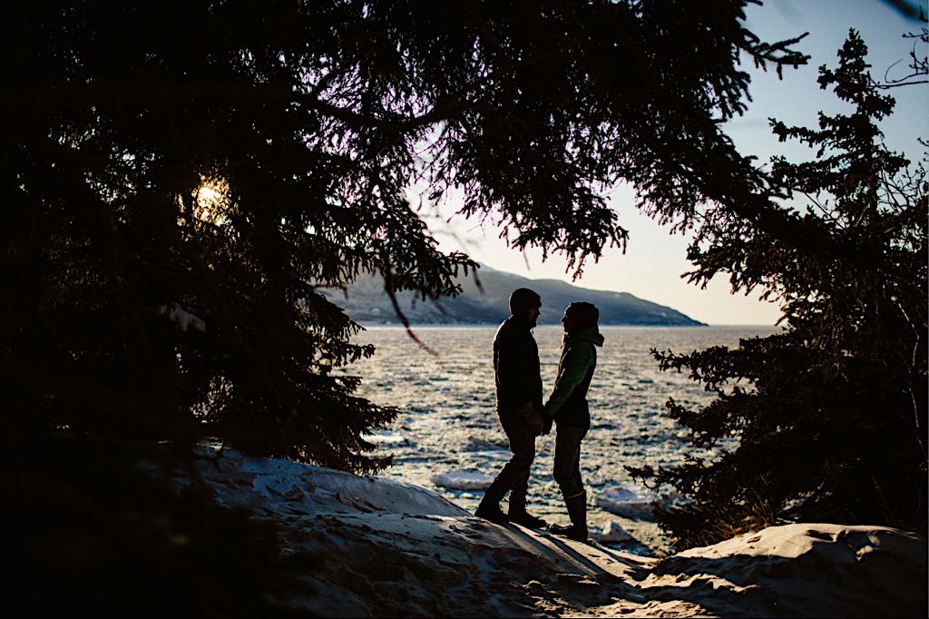 silhouette of couple holding hands at beluga point