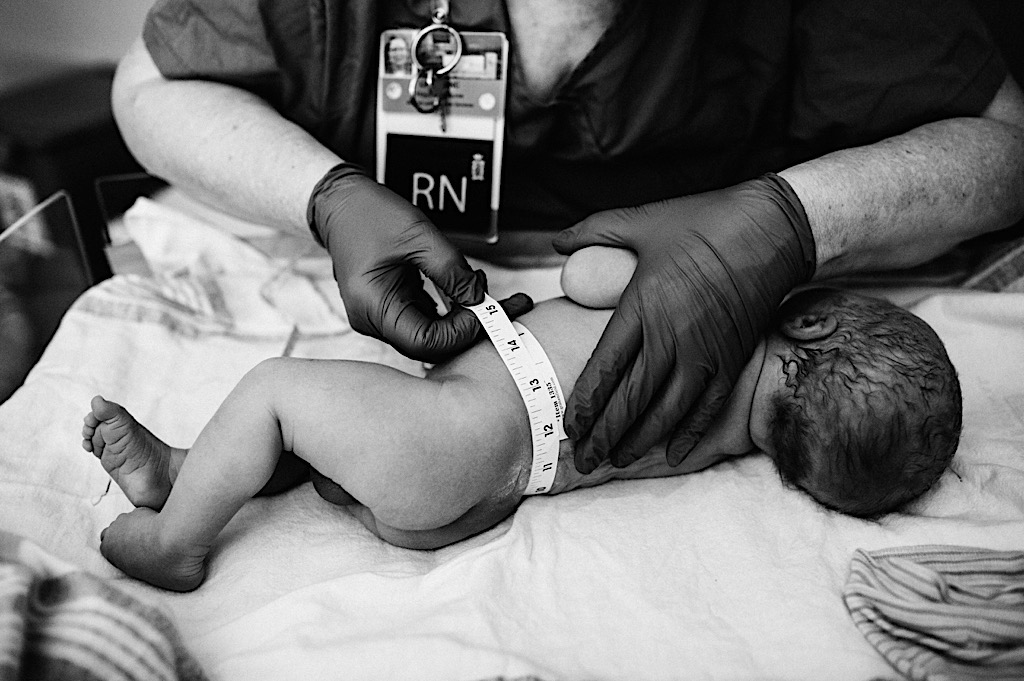 newborn baby gets measured at alaska regional hospital