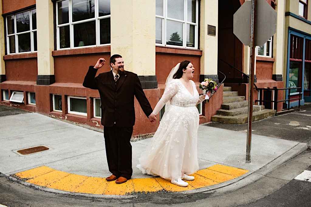 bride yelling and groom laughing downtown seward 