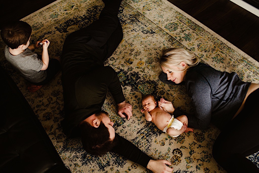 family relaxing on the floor 