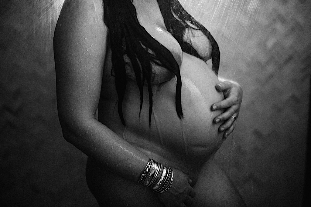 artistic maternity belly in the shower