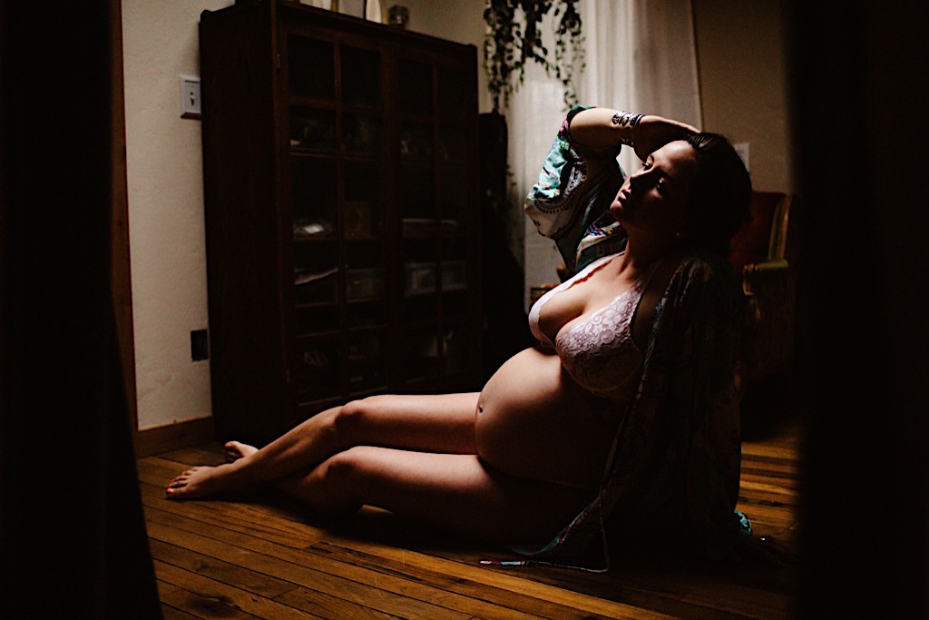 pregnant woman lounging in robe