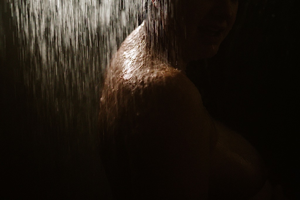 close up of woman's shoulders in the shower