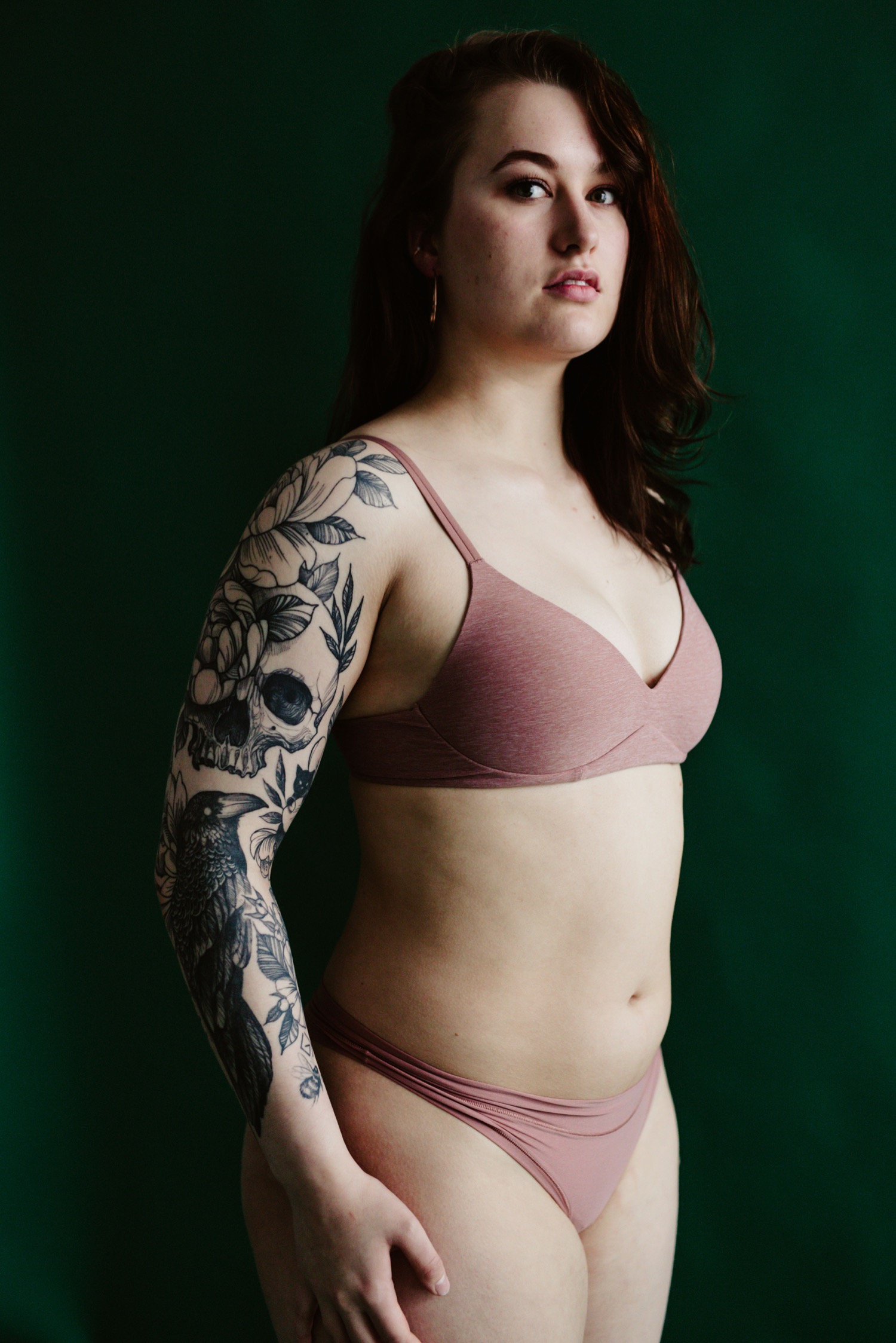 portrait of woman with tattoos looking strong