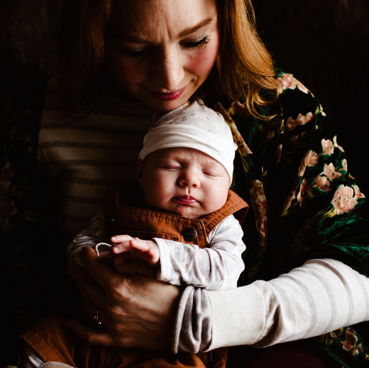 newborn session mother holding baby