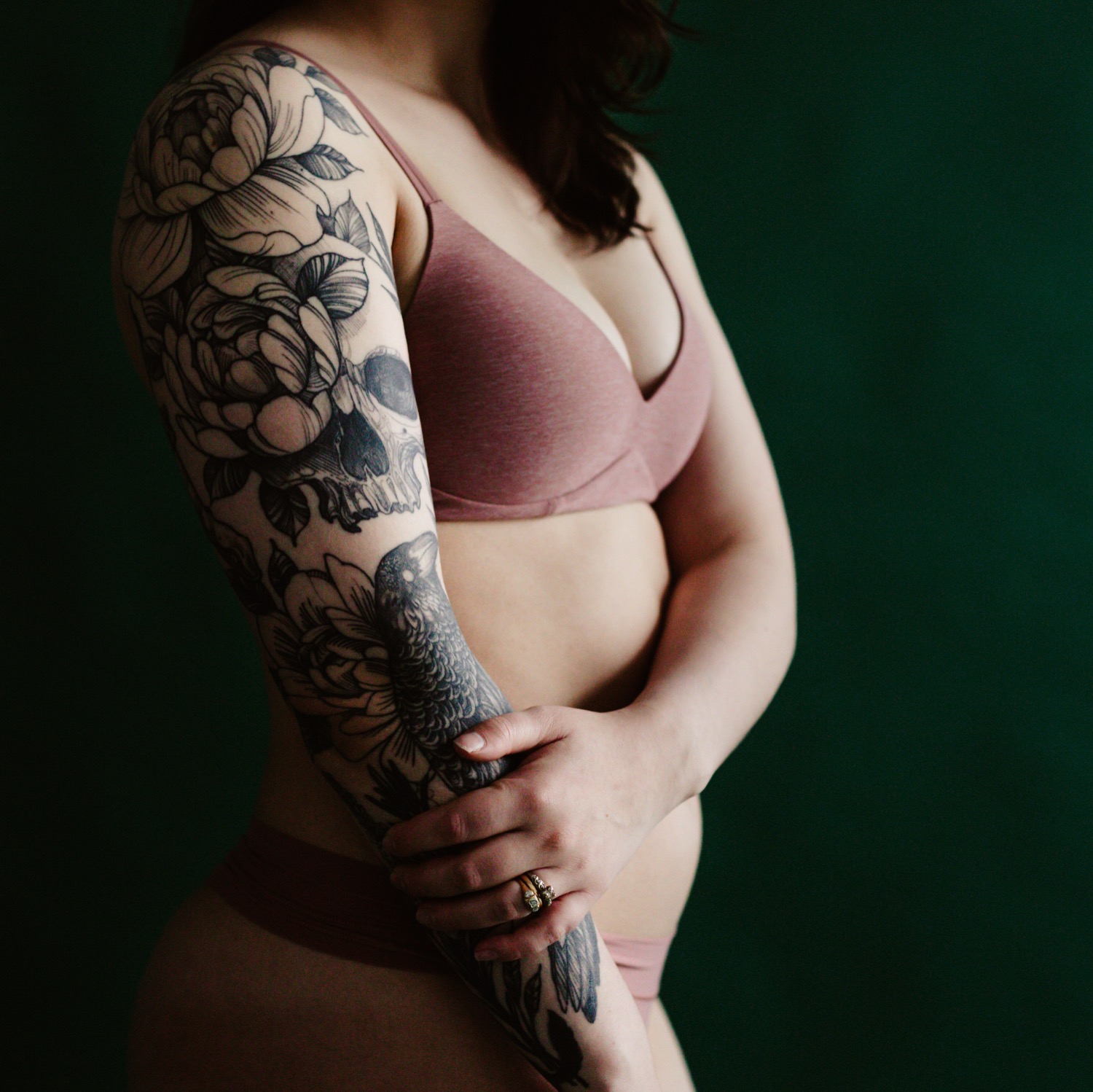 floral tattoo sleeve with pink bra