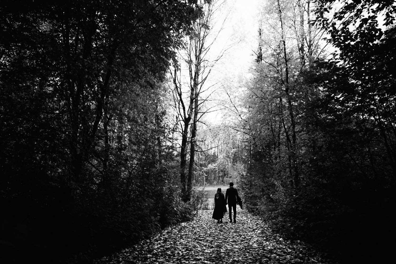 bride and groom walking down chester creek trail