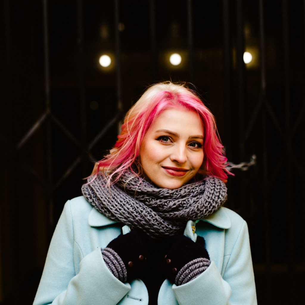 woman with pink hair and blue modcloth coat