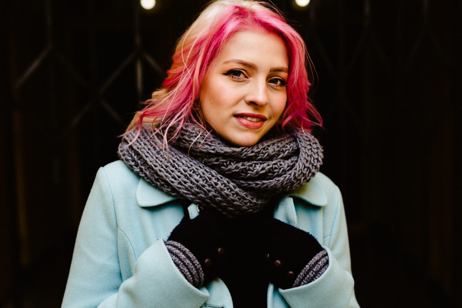 girl with pink hair and light blue modcloth coat