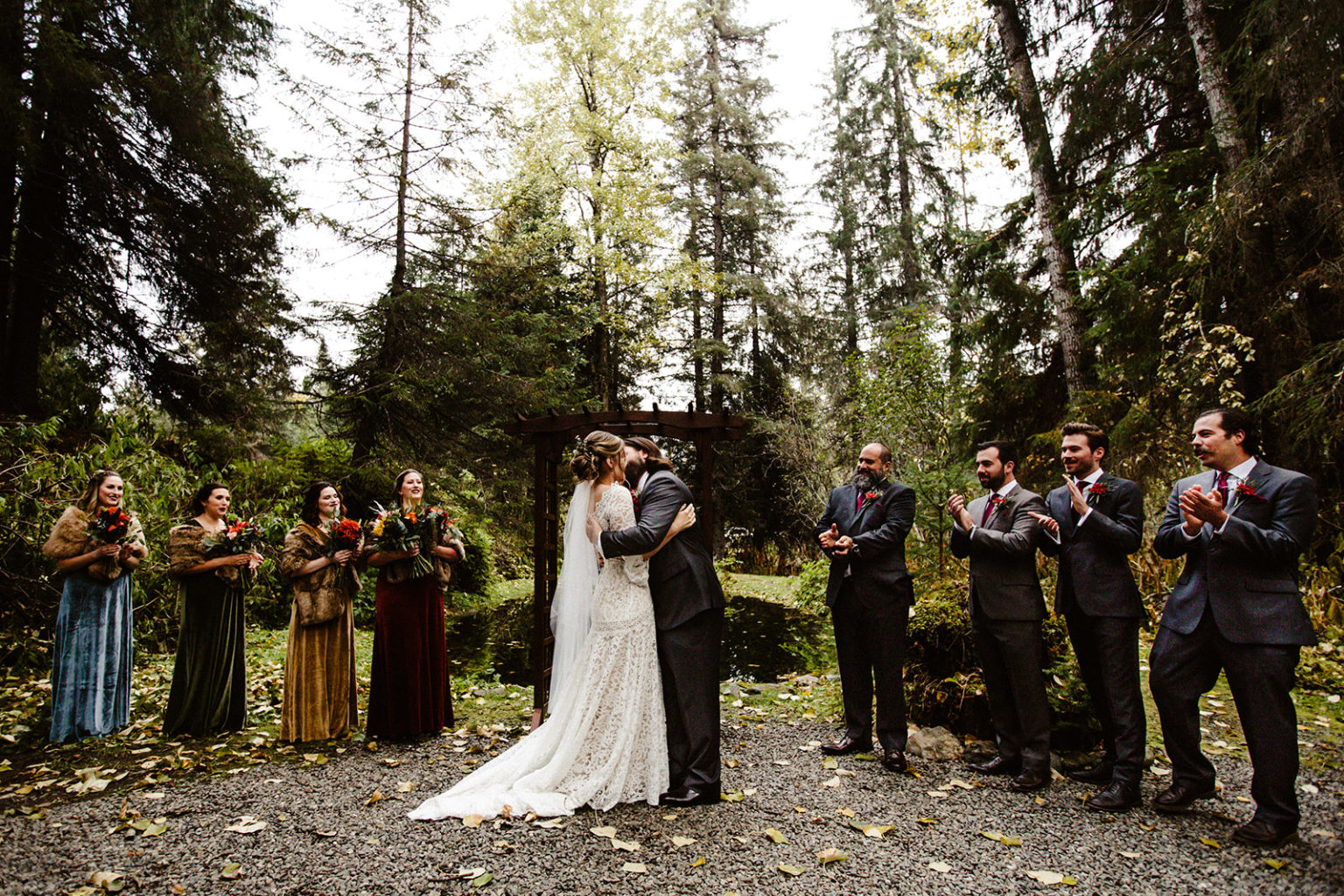 bride and groom share first kiss at raven glacier lodge wedding ceremony