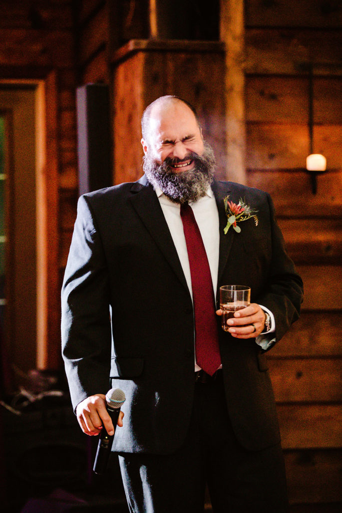 groomsman delivers speech at raven glacier lodge wedding reception